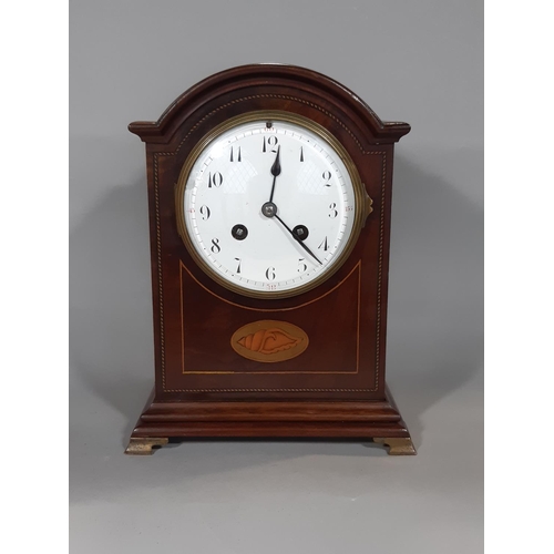 401 - An inlaid Edwardian mahogany mantel clock with convex enamelled dial, French eight day striking move... 