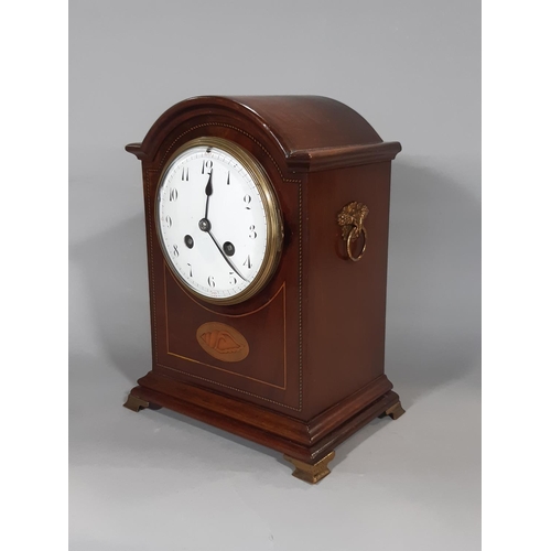 401 - An inlaid Edwardian mahogany mantel clock with convex enamelled dial, French eight day striking move... 