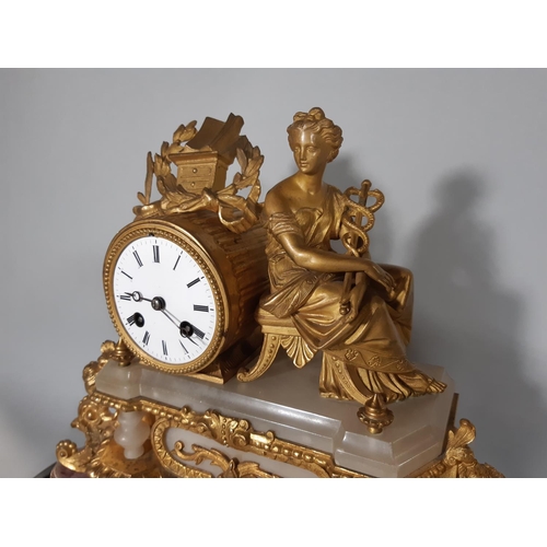 405 - A mid-19th century gilt brass and alabaster panelled mantel clock, surmounted by a female figure rep... 