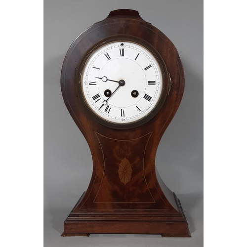 406 - An inlaid Edwardian mahogany mantel clock in a balloon shaped case with convex enamelled dial and ei... 