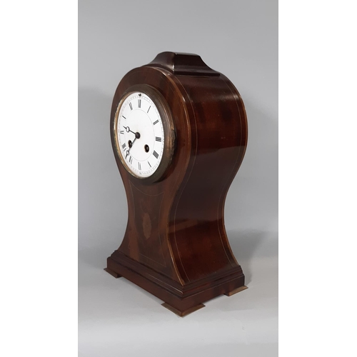 406 - An inlaid Edwardian mahogany mantel clock in a balloon shaped case with convex enamelled dial and ei... 