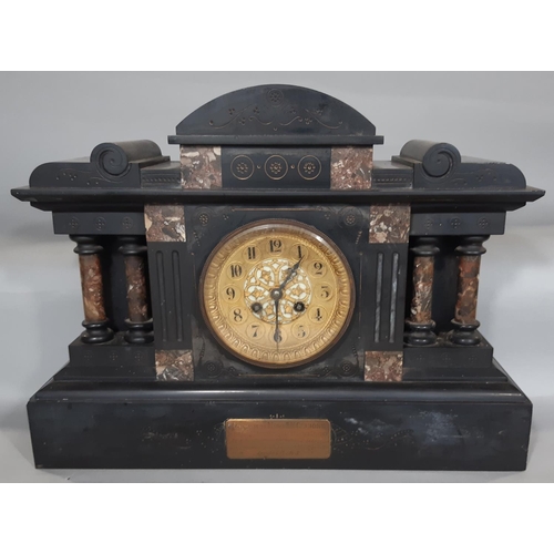 410 - A mid-Victorian period black slate and polished marble mantel clock of architectural form, with eigh... 