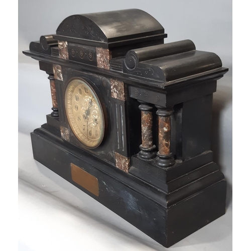 410 - A mid-Victorian period black slate and polished marble mantel clock of architectural form, with eigh... 