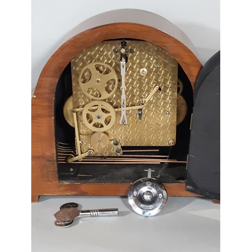 411 - An art deco walnut and figured walnut mantel clock with three train movement, Westminster chime, pen... 