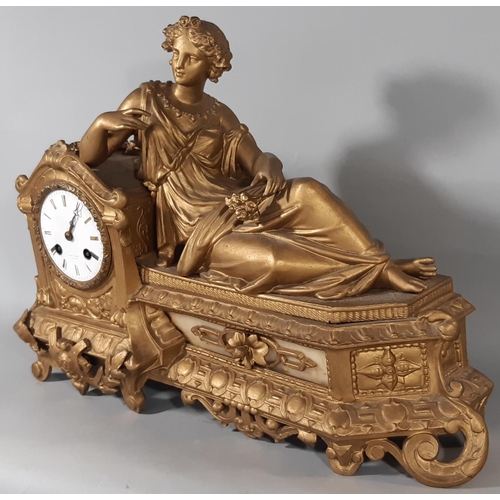 418 - A 19th century gilded spelter mantel clock in the romantic style with eight day striking movement, t... 