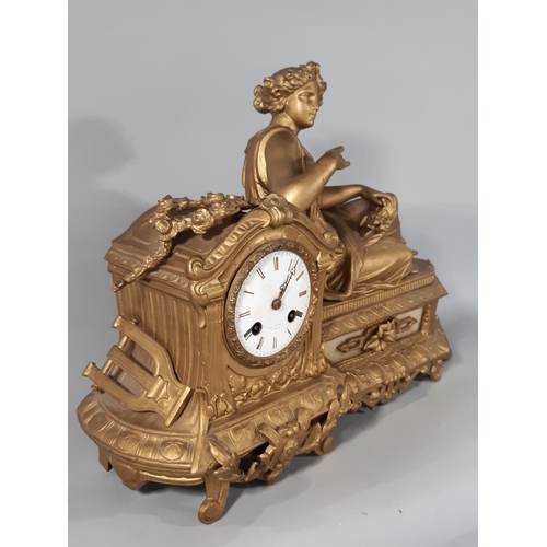 418 - A 19th century gilded spelter mantel clock in the romantic style with eight day striking movement, t... 