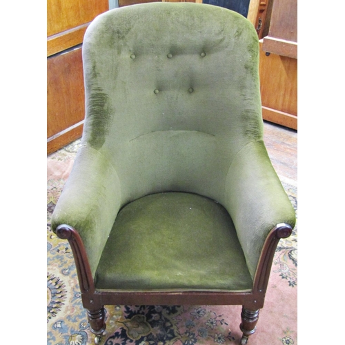 1510 - A mid 19th century library chair with partial show wood frame on turned supports,