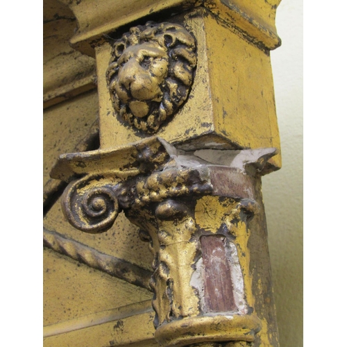 1514 - A Regency period pier glass, the mirror set within column supports beneath ionic capitals and furthe... 