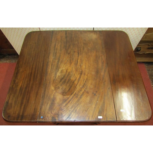 1517 - A Georgian mahogany Pembroke table with one real and one dummy drawer, raised on turned supports