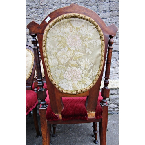1520 - A set of six Victorian walnut dining chairs with turned supports and shaped backs with upholstered s... 
