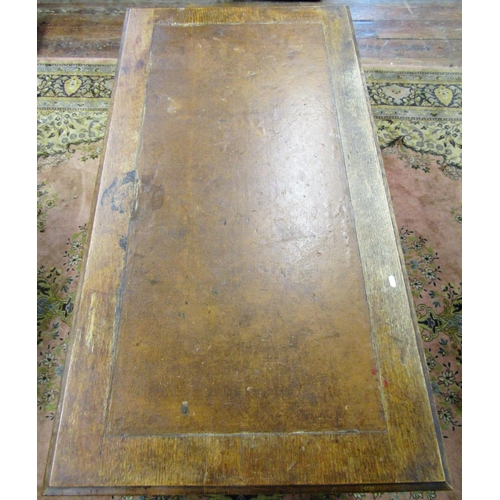 1534 - A late 20th century oak pedestal writing desk fitted with nine graduated drawers with brass plate ha... 