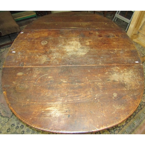 1535 - An 18th century oak gateleg dining table raised on turned supports and stretchers, 115cm long to sea... 