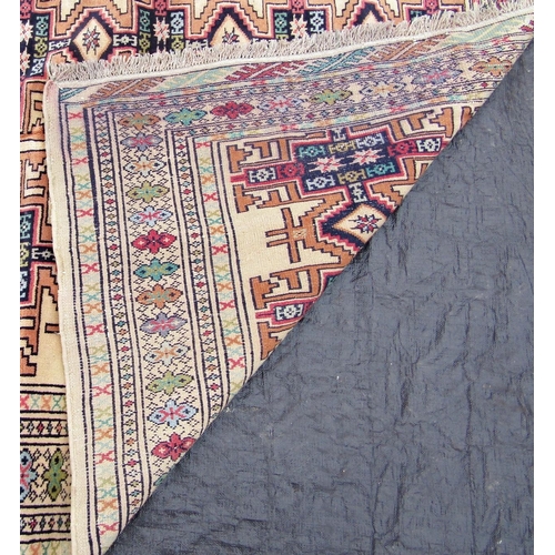 1477 - A Turkoman rug with repeating geometric design on a pale cream ground, 190 x 135cm