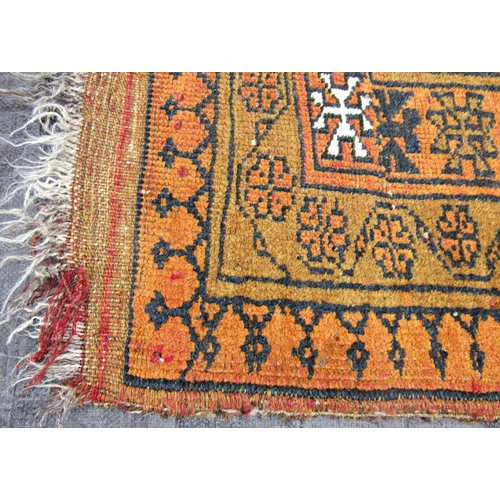 1479 - A middle eastern rug with a central row of four medallions upon a rust red ground, 150 x 100cm