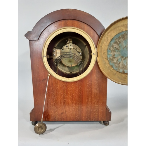 404 - An inlaid Edwardian mahogany mantel clock with string inlay and other detail, with enamelled convex ... 