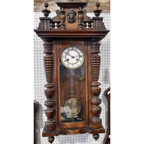 421B - Late 19th century wall clock with eight day striking movement the walnut case with applied mouldings