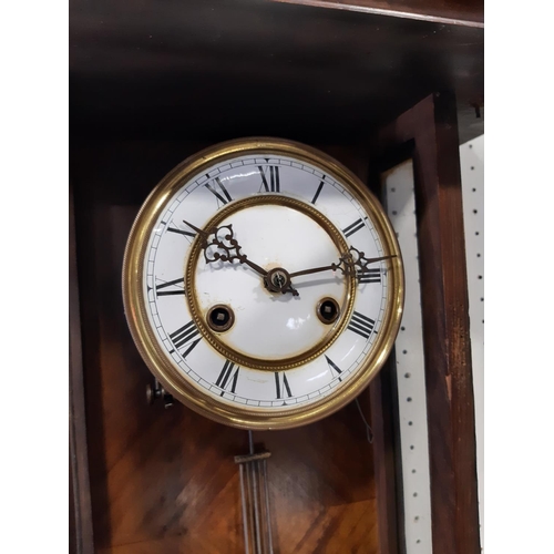 421B - Late 19th century wall clock with eight day striking movement the walnut case with applied mouldings