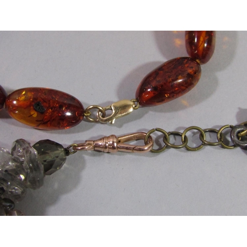 372 - Collection of costume jewellery to include an amber bead bracelet with 9ct clasp, a tassel drop bead... 