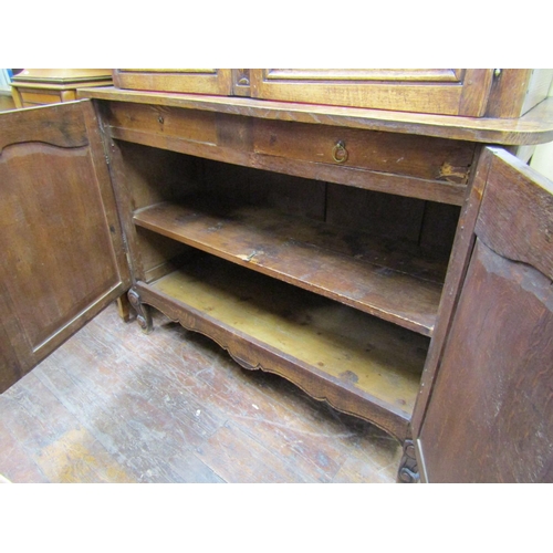1501 - 19th century French oak cabinet, the lower section enclosed by two carved and panelled doors, the up... 