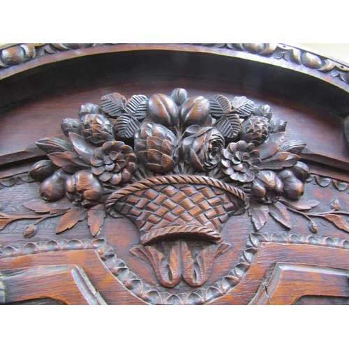 1501 - 19th century French oak cabinet, the lower section enclosed by two carved and panelled doors, the up... 