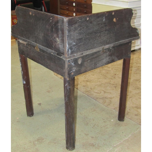 2167 - A 19th century mahogany oval drop leaf corner table with raised and shaped back raised on four cut a... 
