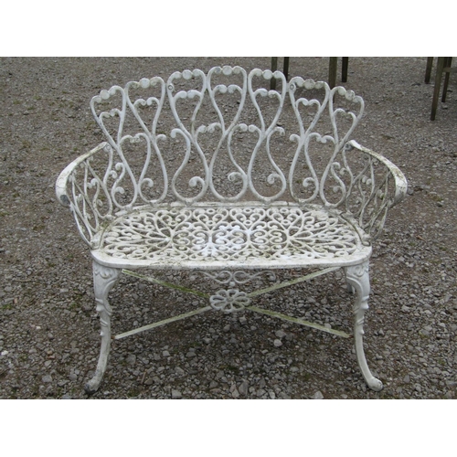 58 - Weathered cream painted cast aluminium garden bench with shaped outline and decorative pierced and s... 