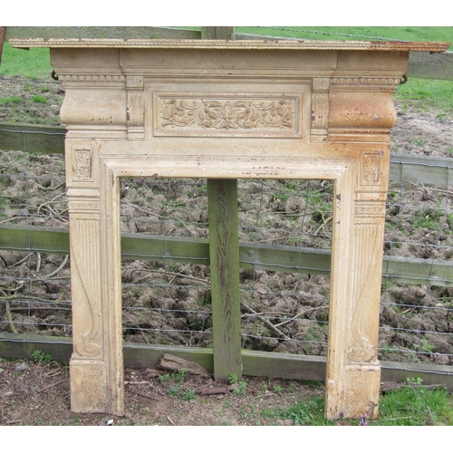 60 - A 19th century cast iron fire surround with scrolling acanthus, further decorative classical detail ... 