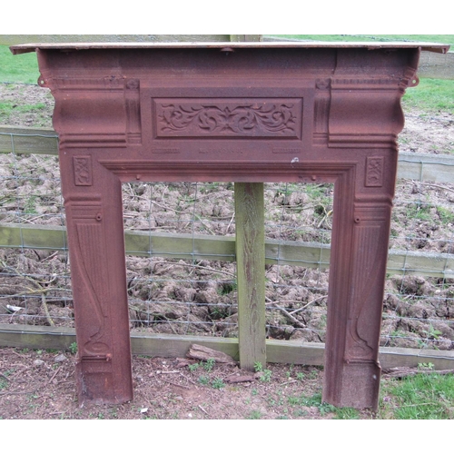 60 - A 19th century cast iron fire surround with scrolling acanthus, further decorative classical detail ... 