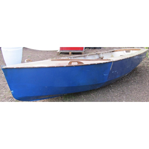 66 - A vintage wooden dinghy with blue painted hull (af) approx 13.5ft long x 160cm wide (used as a film ... 