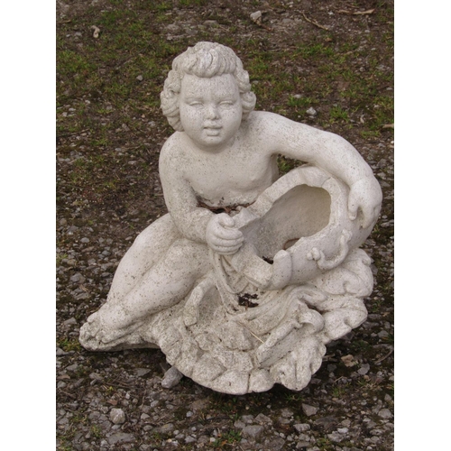 67 - A cast composition stone water feature in the form of a seated putti clutching a barrel shaped recep... 