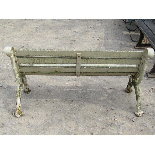 315 - A Victorian two seat garden bench with timber lathes raised on a pair of heavy gauge cast iron natur... 