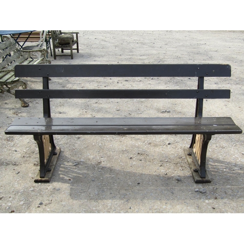 316 - Railway interest - A GWR platform bench with painted timber lathes raised on heavy cast iron support... 