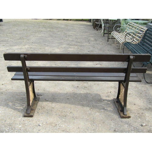 316 - Railway interest - A GWR platform bench with painted timber lathes raised on heavy cast iron support... 