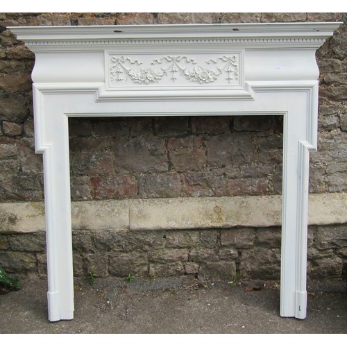 739 - 19th century fire surround with ribbon and garland panel a moulded frame, 142cm wide x 134cm high