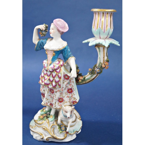 1067 - A pair of 18th century continental porcelain candlesticks with male and female characters each with ... 