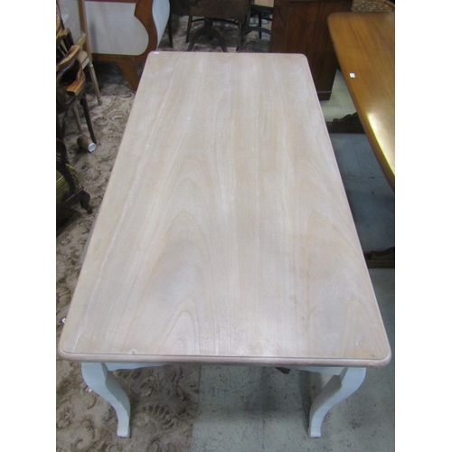 2072 - A contemporary kitchen table with scrubbed top raised on a painted framework with shaped supports, t... 