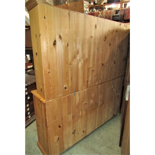 2093 - A good contemporary pine kitchen dresser the lower section enclosed by two pairs of panelled cupboar... 