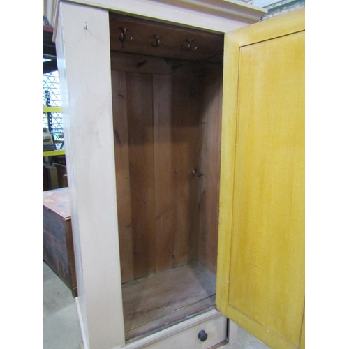 2105 - A painted pine hanging wardrobe with hanging door over a single frieze drawer 205 cm in height