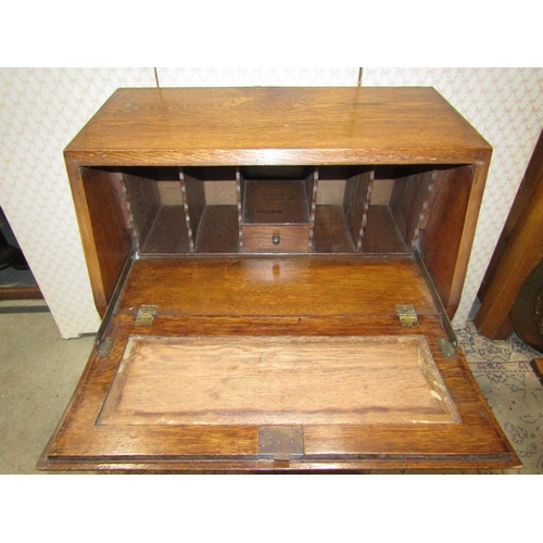 2118 - An early 20th century oak freestanding hall robe, with applied mouldings, enclosed by a full length ... 