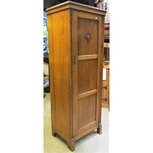 2118 - An early 20th century oak freestanding hall robe, with applied mouldings, enclosed by a full length ... 