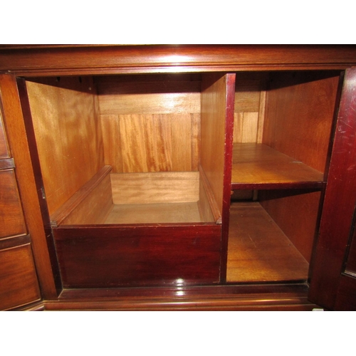 2124 - An Edwardian mahogany sideboard with bow fronted centre fitted with three frieze drawers flanked by ... 