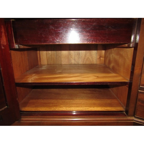 2124 - An Edwardian mahogany sideboard with bow fronted centre fitted with three frieze drawers flanked by ... 