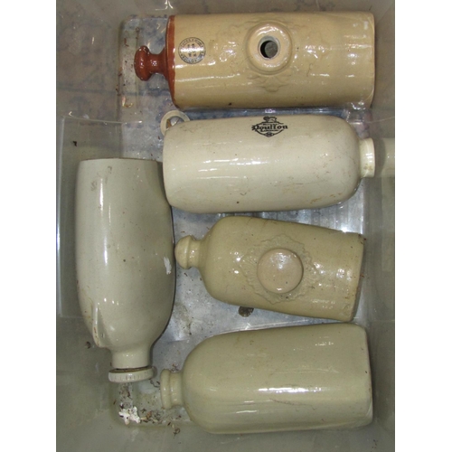 2132 - A box of 19th century and later ceramic and stone hot water bottles some with printed script