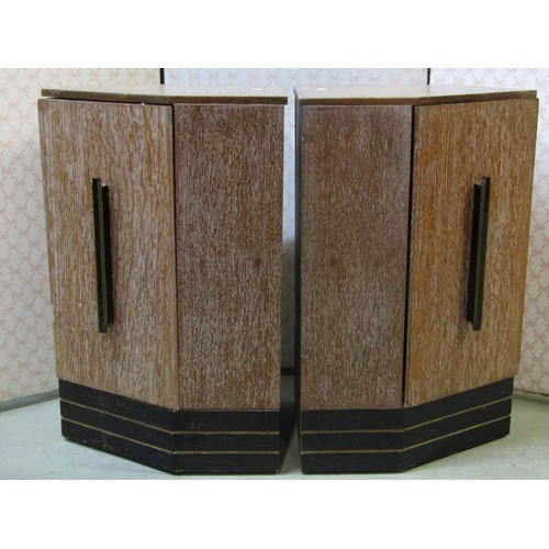 2145 - An Art Deco style limed/fumed linen cupboard with fixed stepped and moulded handles and enclosed by ... 