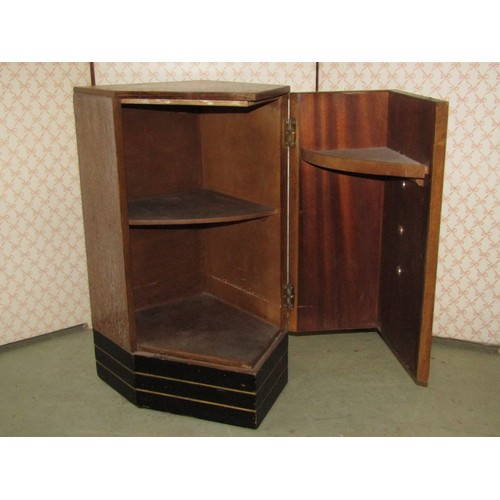 2145 - An Art Deco style limed/fumed linen cupboard with fixed stepped and moulded handles and enclosed by ... 