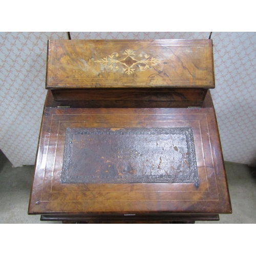 2153 - A Victorian figured walnut writing slope on stand with raised and segmented stationery compartment o... 