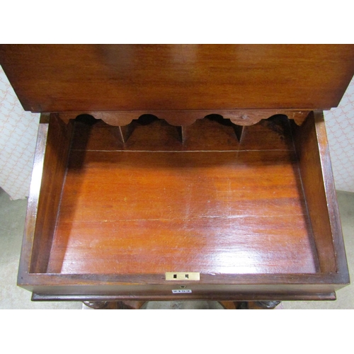 2153 - A Victorian figured walnut writing slope on stand with raised and segmented stationery compartment o... 