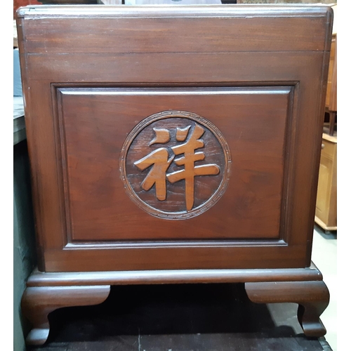 2168 - A Chinese camphor wood coffer with simple carved decoration on ogee supports, 110 cm