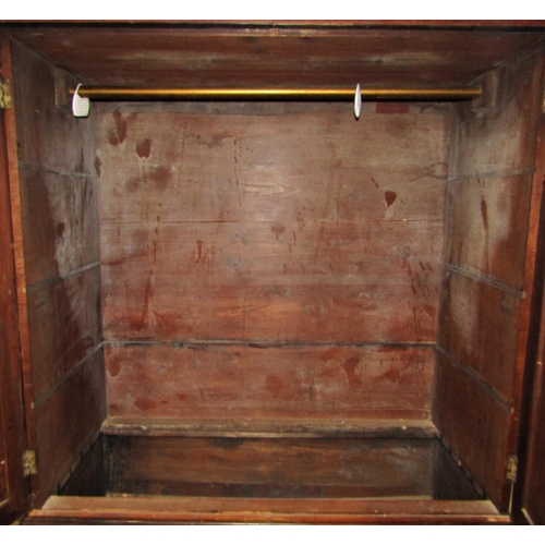 2172 - A Georgian mahogany linen press, the upper section enclosed by  a pair of well matched flame veneere... 