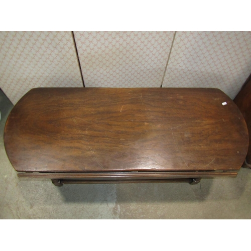 2184 - An old English style oak occasional table of lobbed form, rectangular with drop leaves raised on fou... 